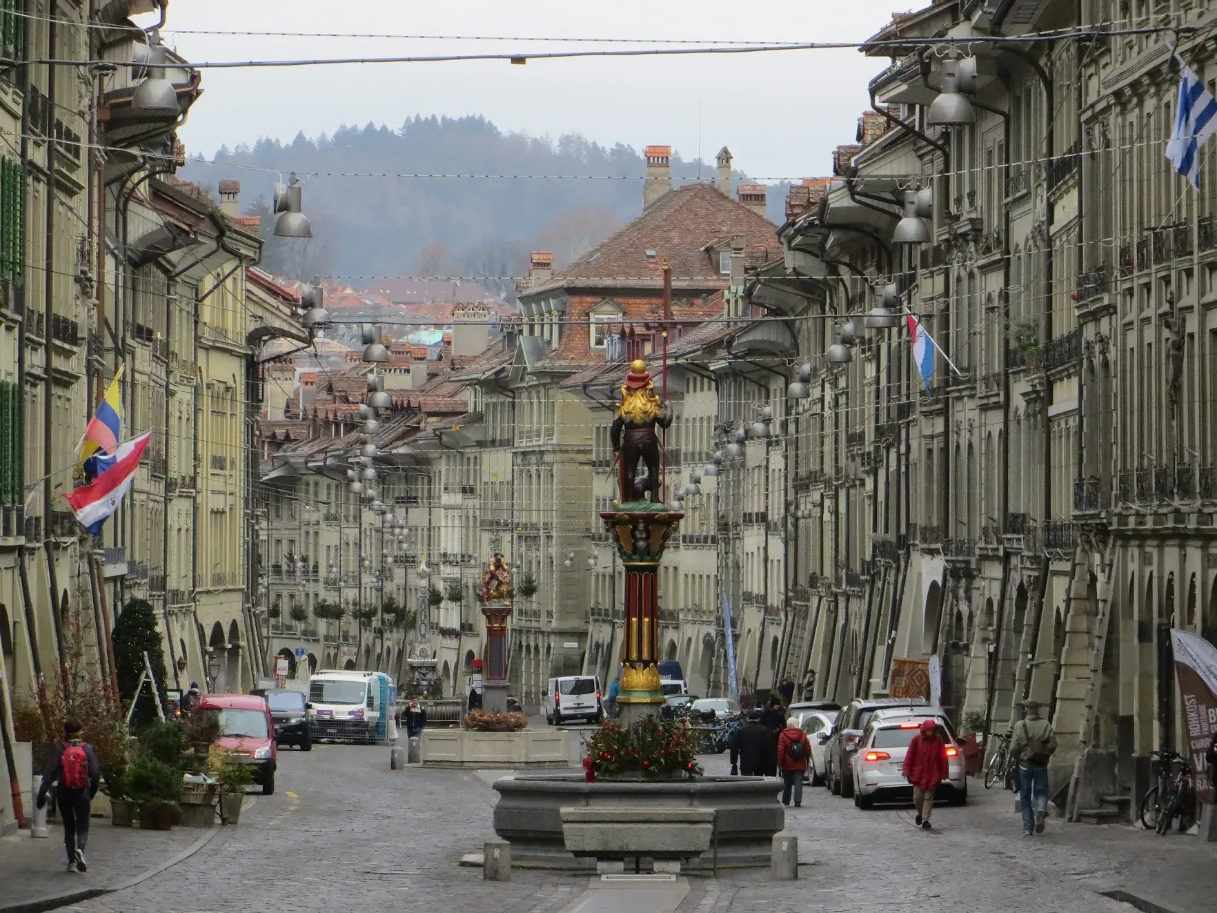 Kramgasse in Bern old town, with arcaded buildings and a painted fountain statue