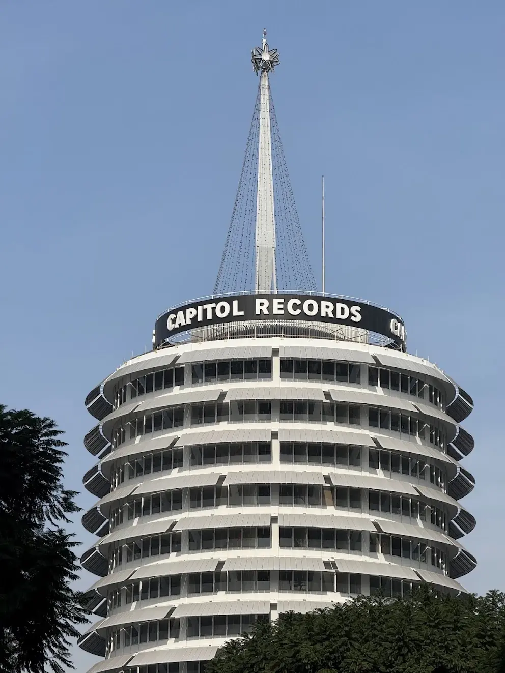 The Capitol Records tower in Hollywood against a blue sky