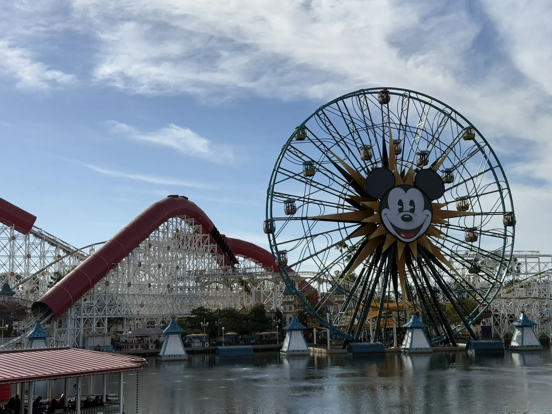 The Pixar Pal-A-Round Ferris wheel with Mickey's face and the Incredicoaster by day