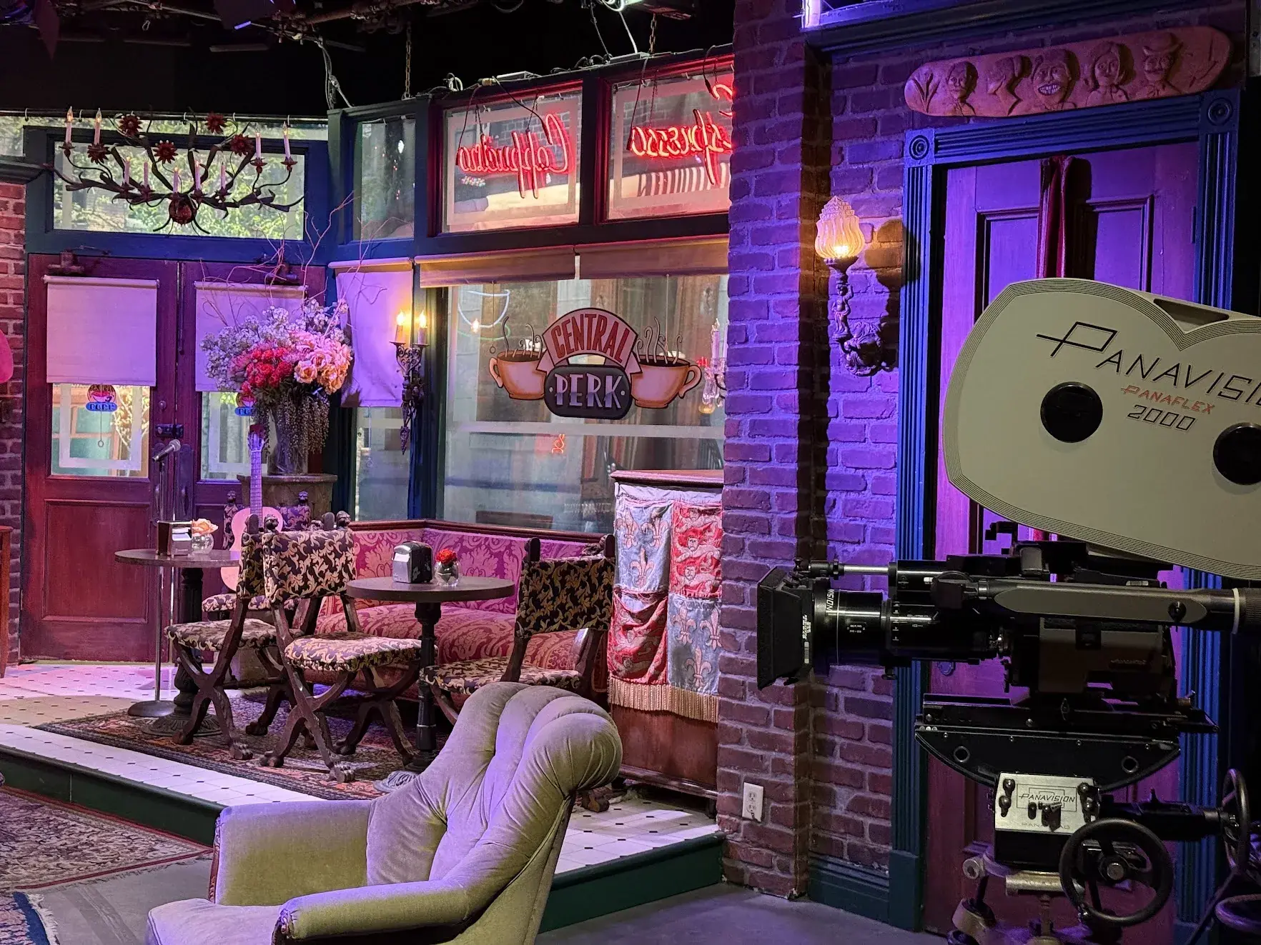 The Central Perk set seen past a vintage Panavision film camera
